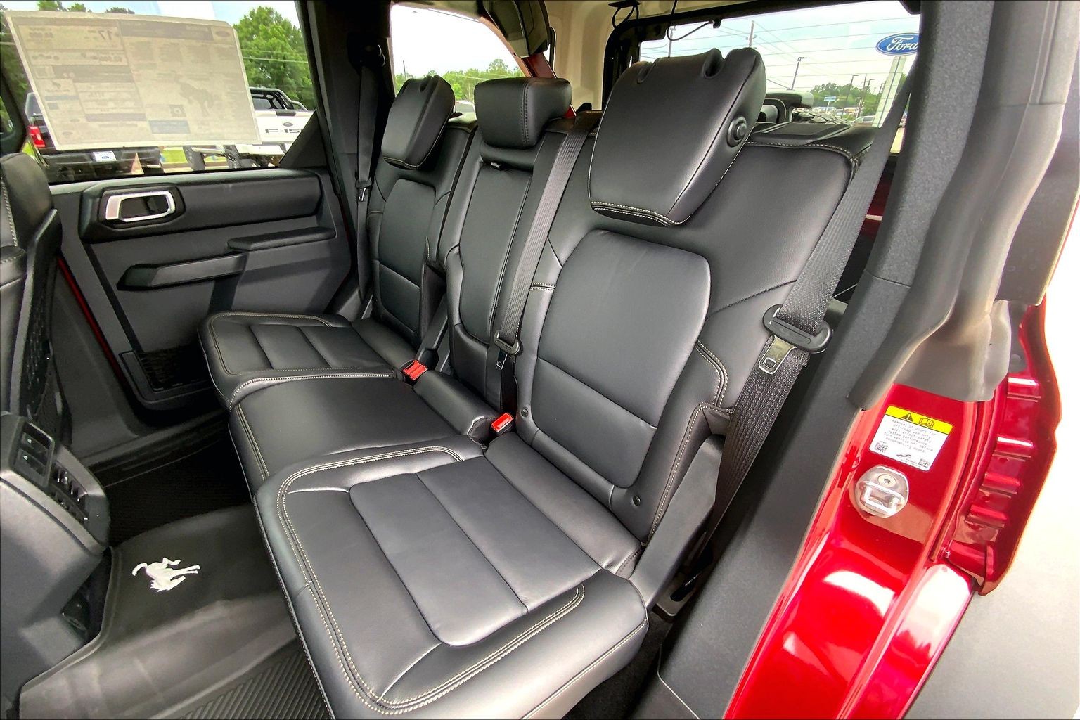 2026 Ford Bronco Badlands Ruby Red Metallic Tinted Clearcoat at Lufkin Ford