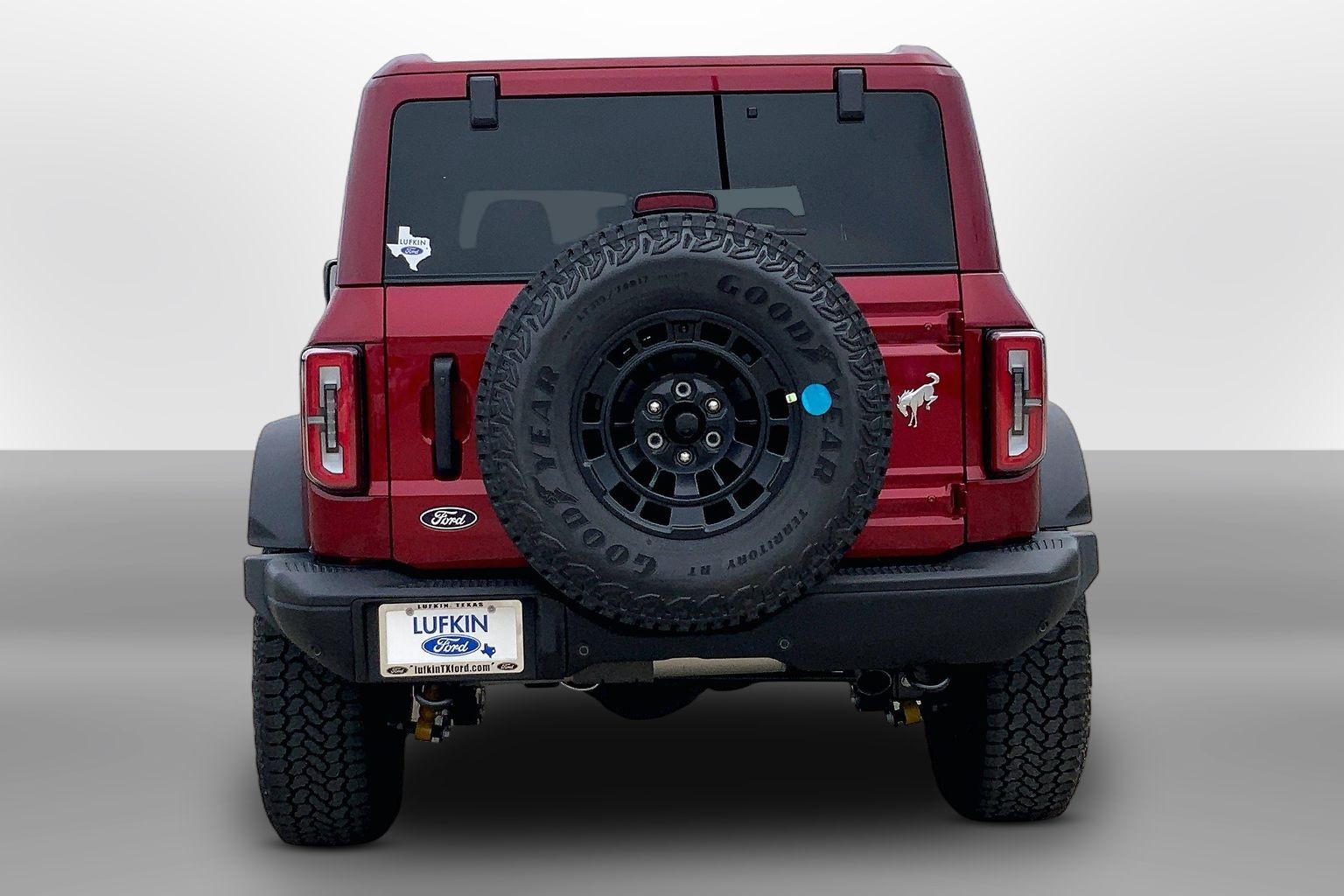 2026 Ford Bronco Badlands Ruby Red Metallic Tinted Clearcoat at Lufkin Ford