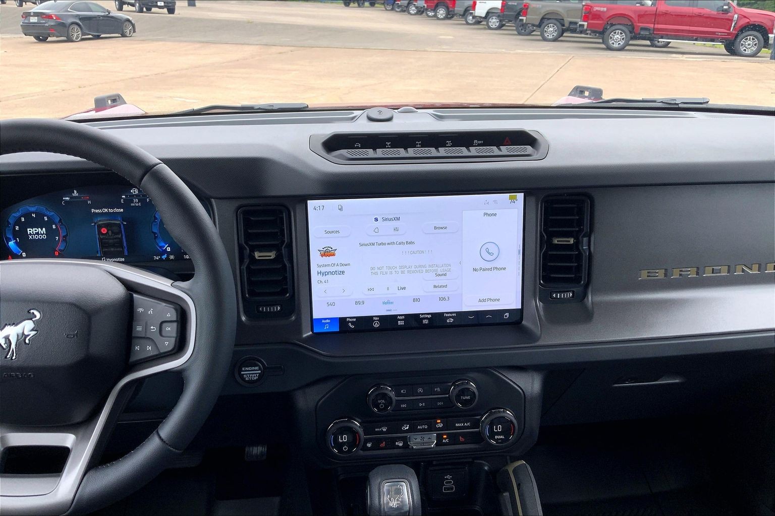 2026 Ford Bronco Badlands Ruby Red Metallic Tinted Clearcoat at Lufkin Ford